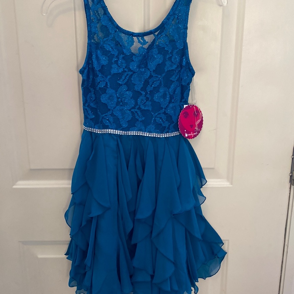 Girl’s size 12 dress. Emily West. BRAND NEW. NEVER WORN.